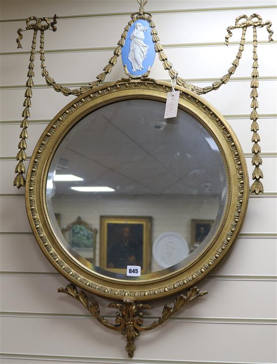 A Victorian gilt convex wall mirror inset Wedgwood plaque, H.87cm